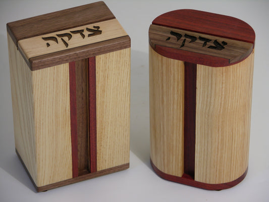 Tzedakah Boxes (EC18) featuring laser-engraved Hebrew text on premium hardwood with maple body and contrasting wood accents for religious giving.